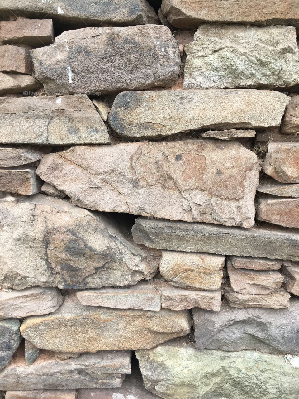 Old farmhouse stacked stone wall