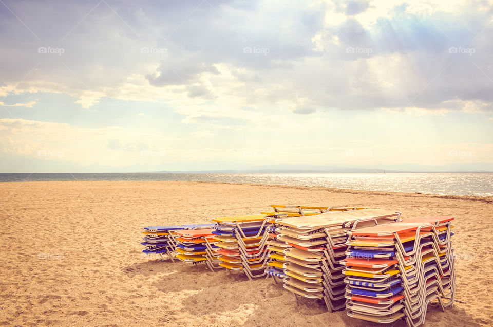 Colorful Sunbeds At The Beach
