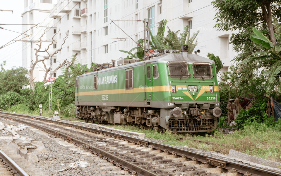 Howrah, Kolkata, August 20, 2019 – A high power electric WAG-9 locomotive loco engine wagon on rail tracks of Indian Railway. WAG-9 locomotives is most powerful freight locomotive in Indian Railways.