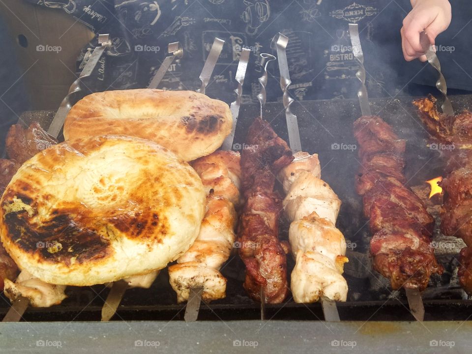 Charcoal grilled meat and two pita bread