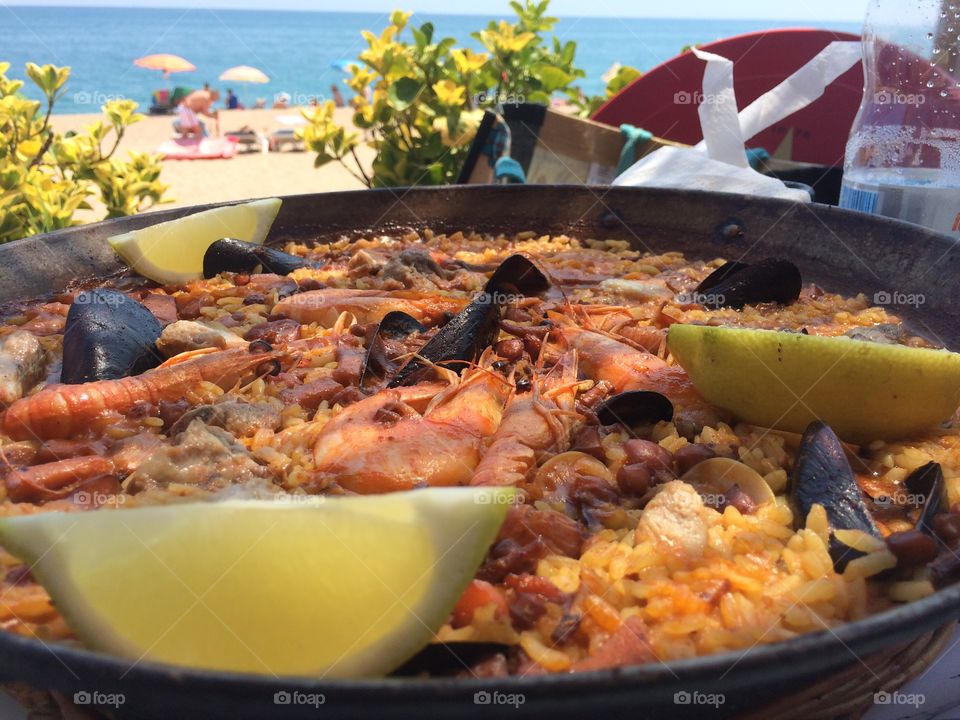 Paella . It' s the mixed seafood paella which you can try in Costa Maresme. 
