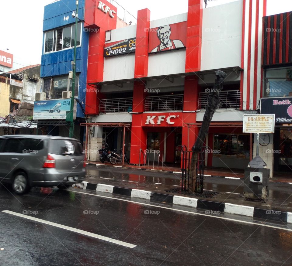 kfc on Malioboro street, yogyakarta, Indonesia. KFC is on the classic and famous street. city ​​with full of traditions and culture. KFC is present in the middle.
