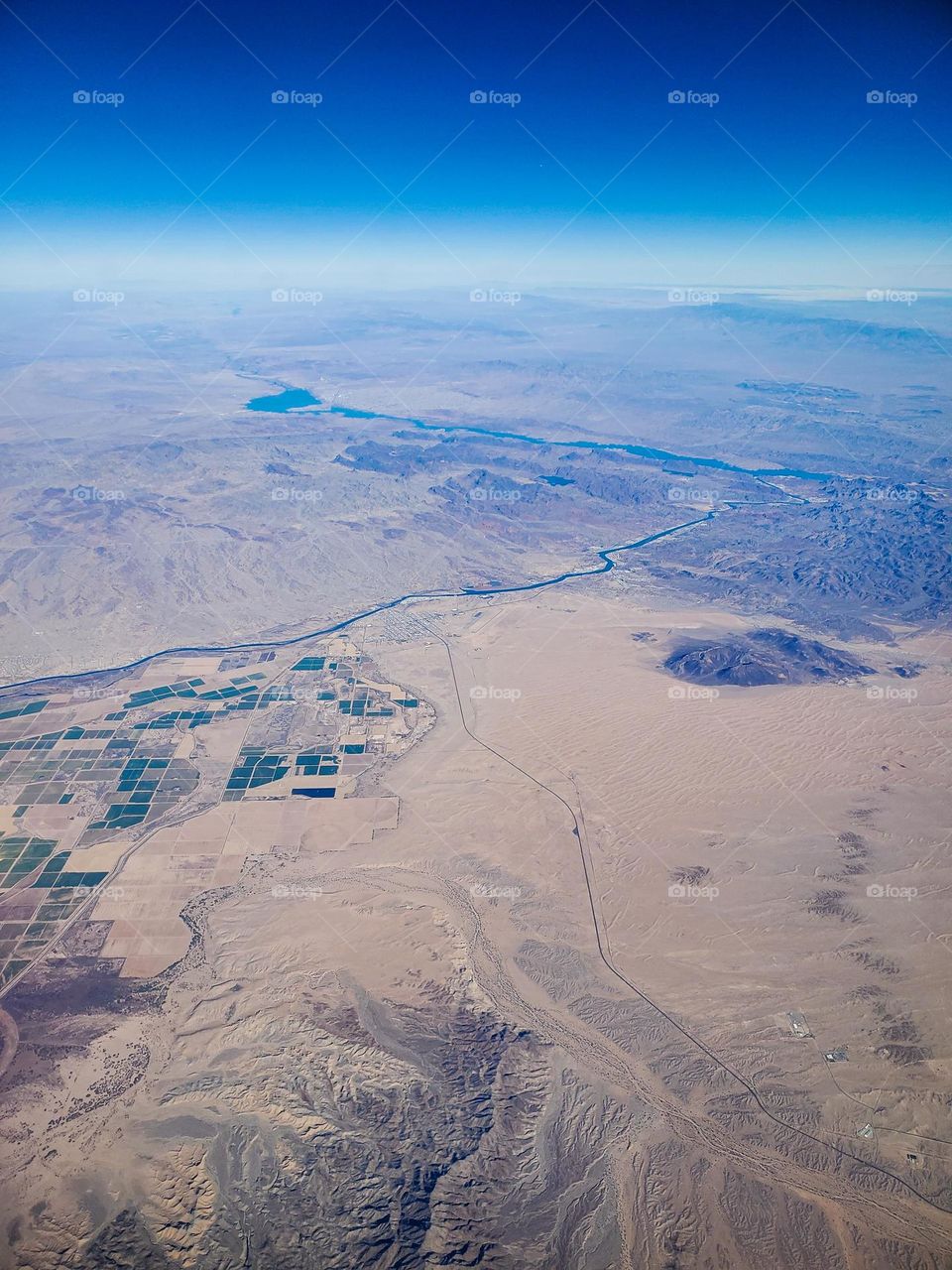 Dividing California and Arizona, the Colorado River cuts a thin ribbon through the arid desert region