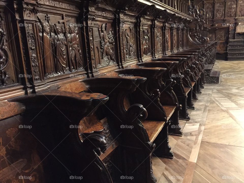 Empty clergy chairs in a cathedral  once used by archbishops