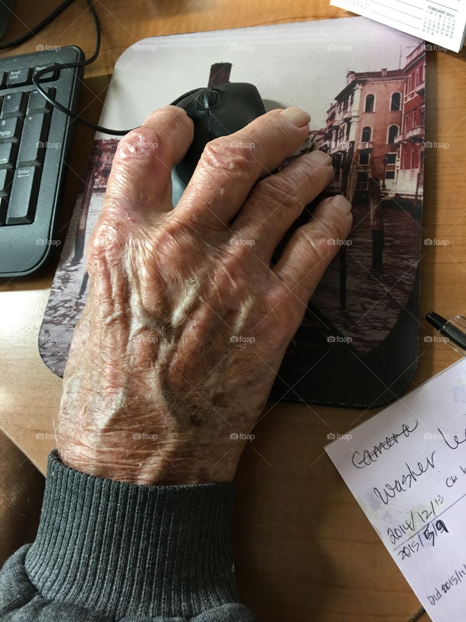 Overhead view of hand on computer mouse 