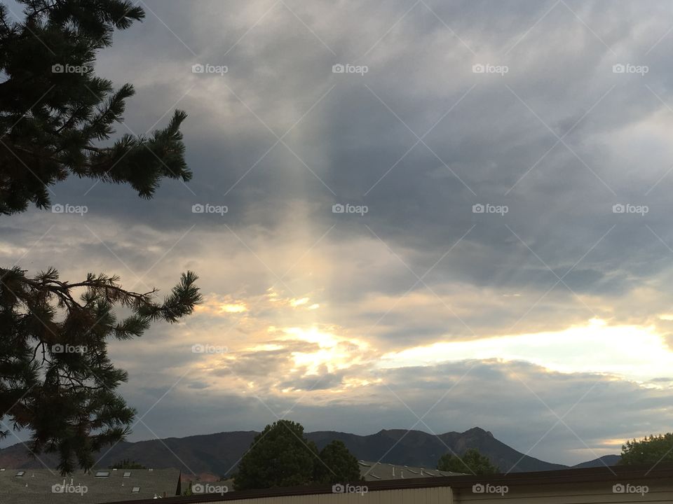 Sunbeams protruding through the clouds