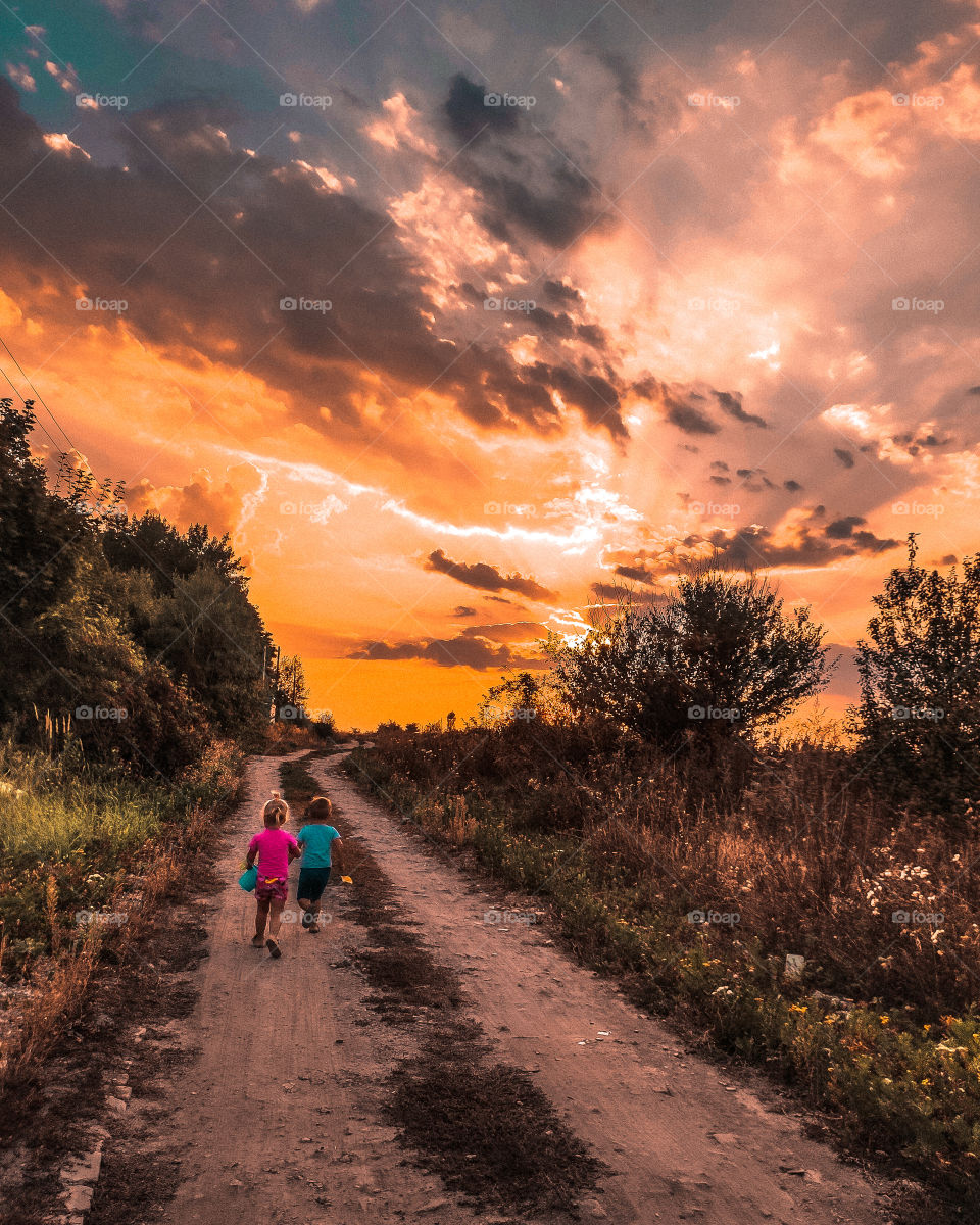 children walk along the road