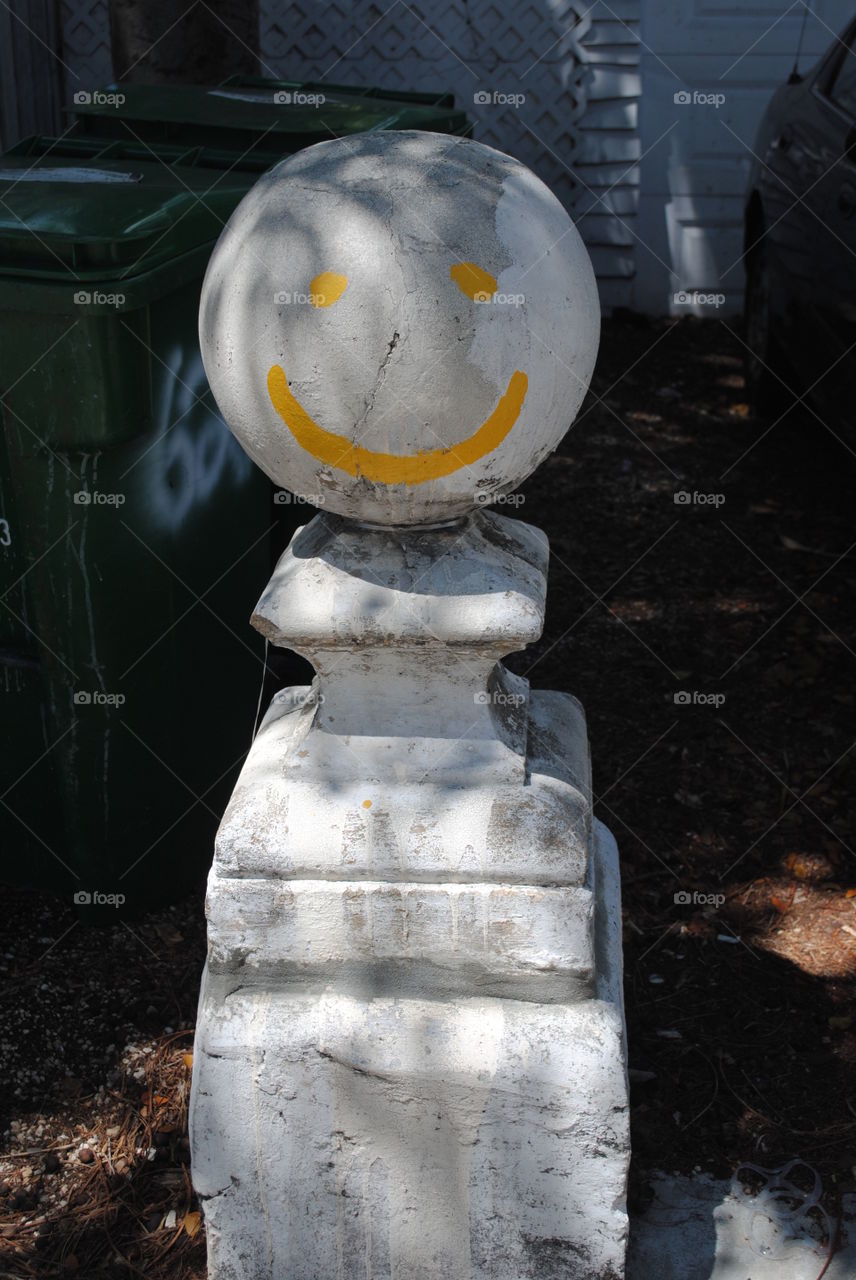 Smiley face statue