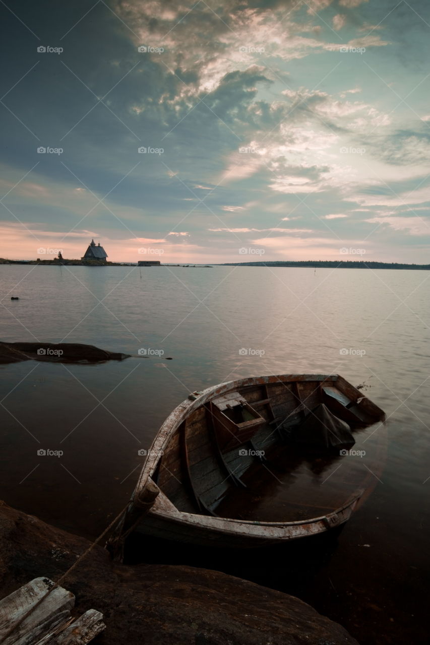 White Sea at early motning. Wooden church in Rabocheostrovsk, Kem, Russia