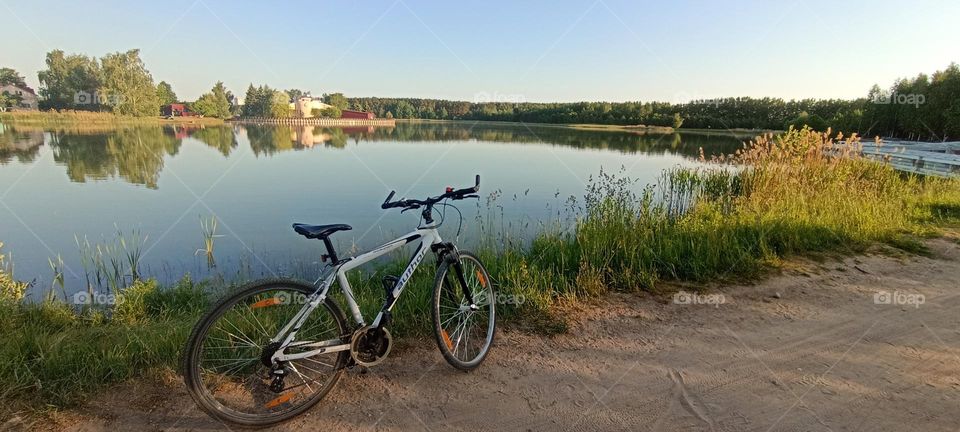 bike 🚲 on a rural road beautiful nature landscape lake shore