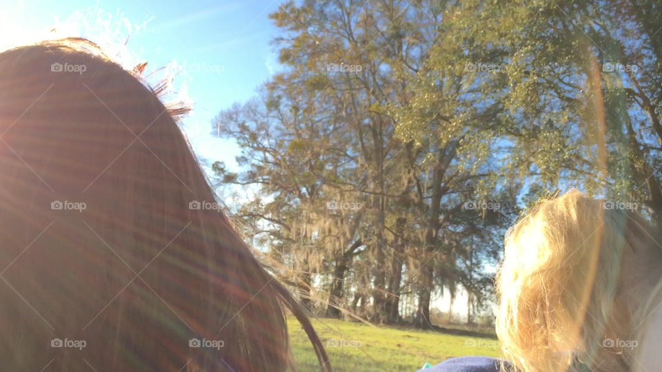 Riding on the farm with the wind blowing in your hair and sunlight on your face.