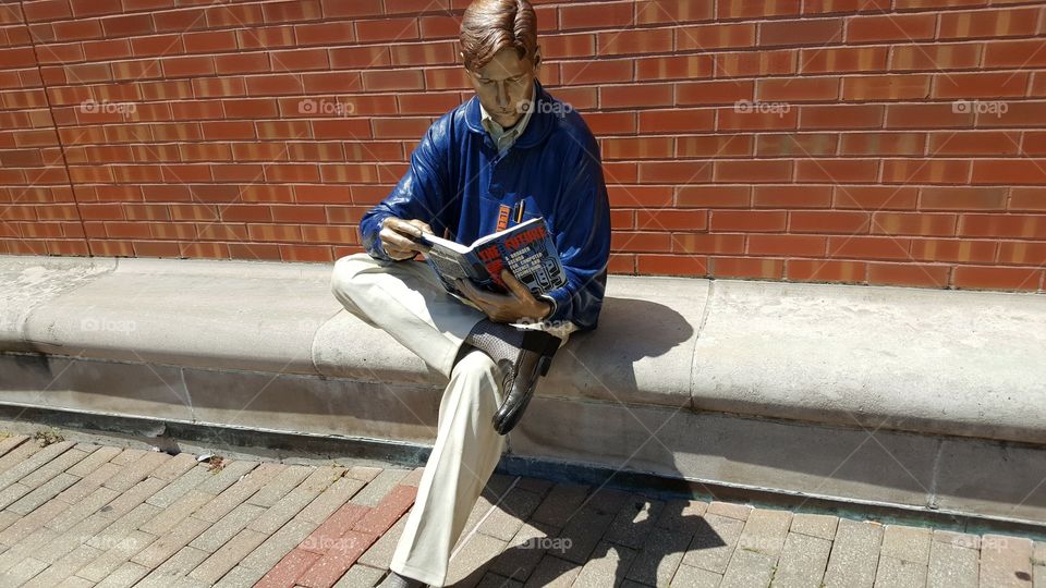 this is NOT a real person... it's a permanent statue