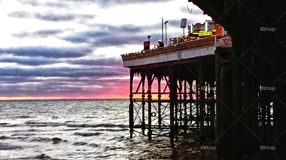 Sunset through the pier