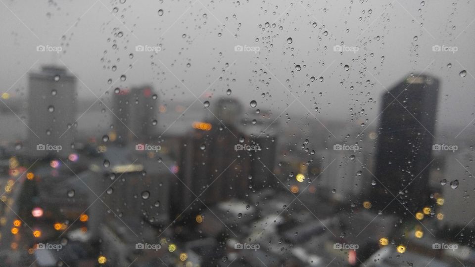 Raindrops against a cityscape