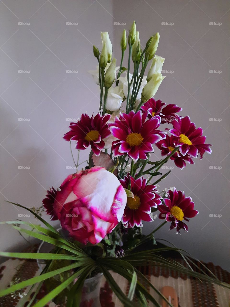 bouquet of flowers in a room corner