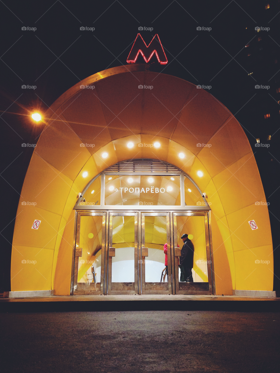 Brightly decorated entrance to one of the Moscow city metro underground stations at night