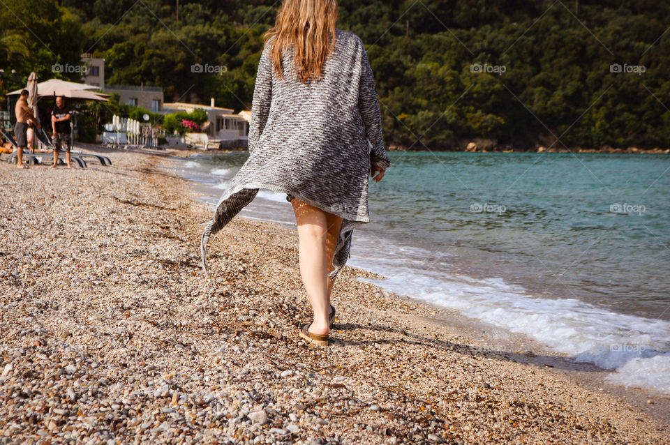 Woman walking at the beach