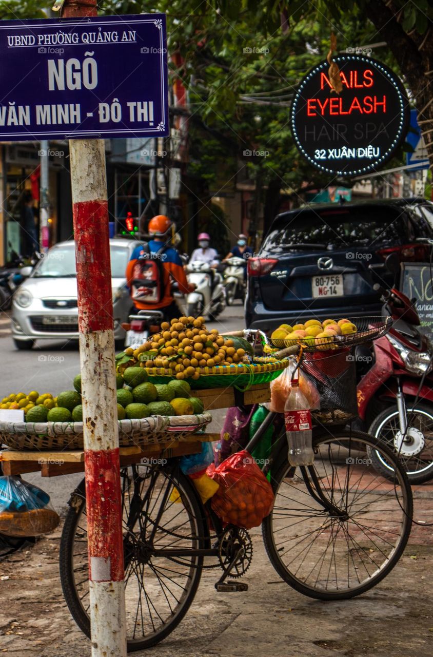 Lonely bicycle with fruits in Hanoi, Vietnam 