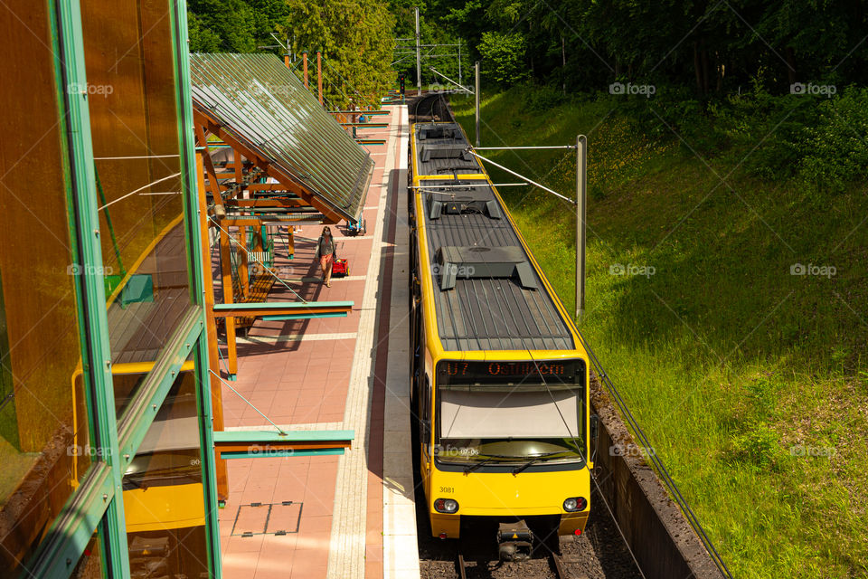 yellow tram in a station