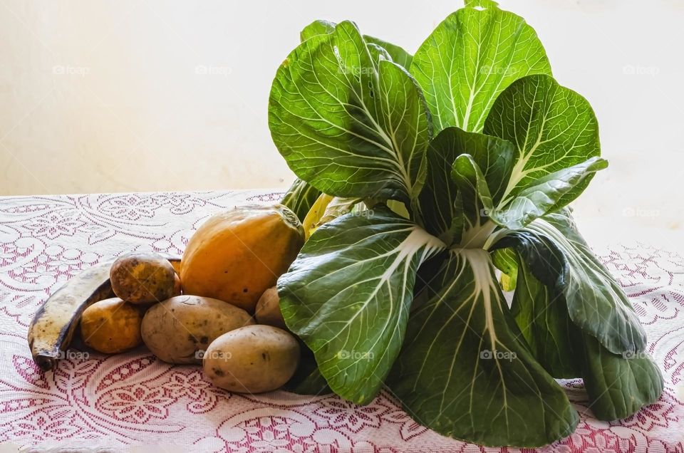 Papaya, White Potatoes, June Plum, Plantain And Pak Choi