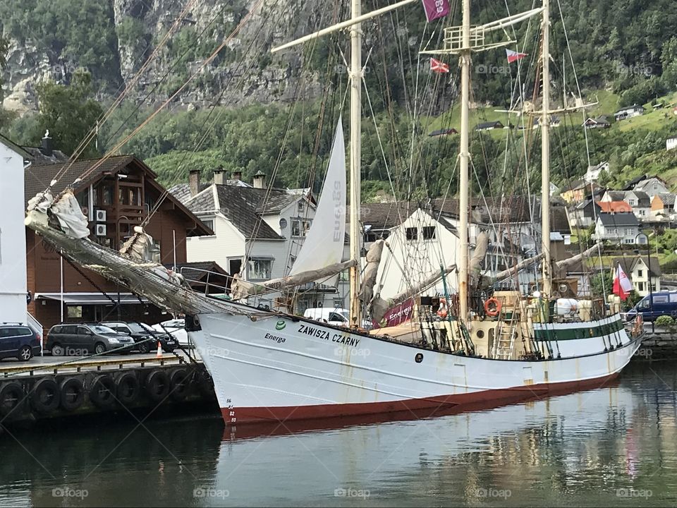 Saling ship by the Dock. Docked ship. White sailing ship.
