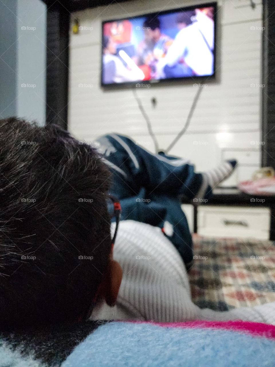 A kid watching television