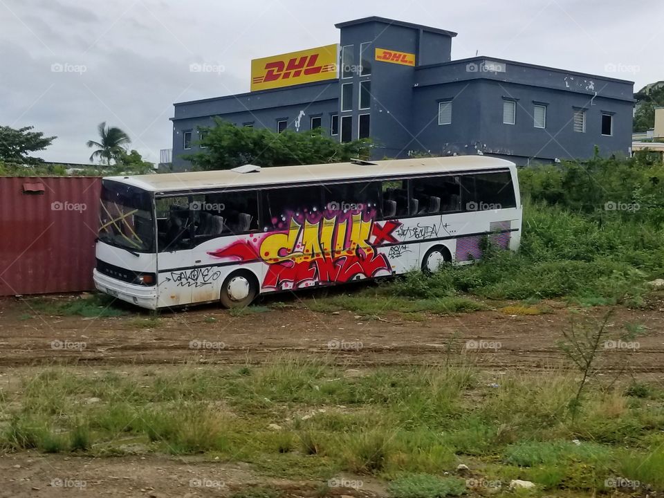 Calligraphy all over a bus left damaged from a the hurricane that hit their island in 2017. St Maarten