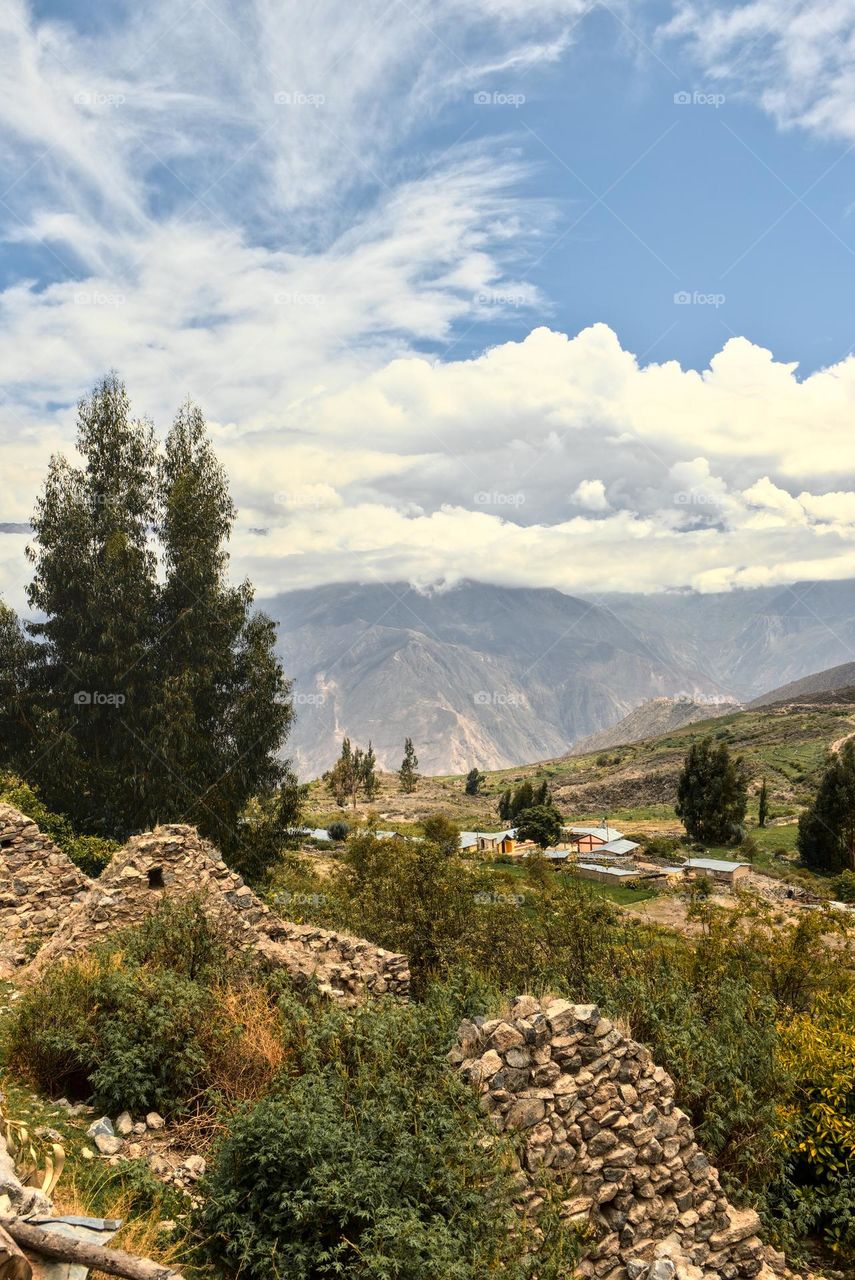 Landscape of houses in the mountains. Population in the Andes. Village of inhabitants of the mountain range.