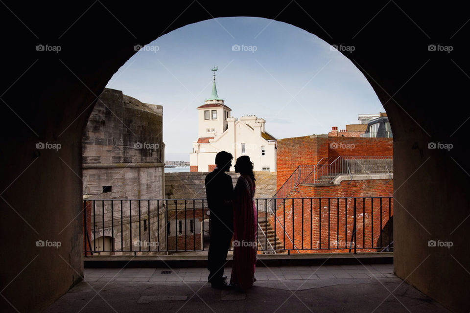lovers couple silhouette arch by richfordphotog