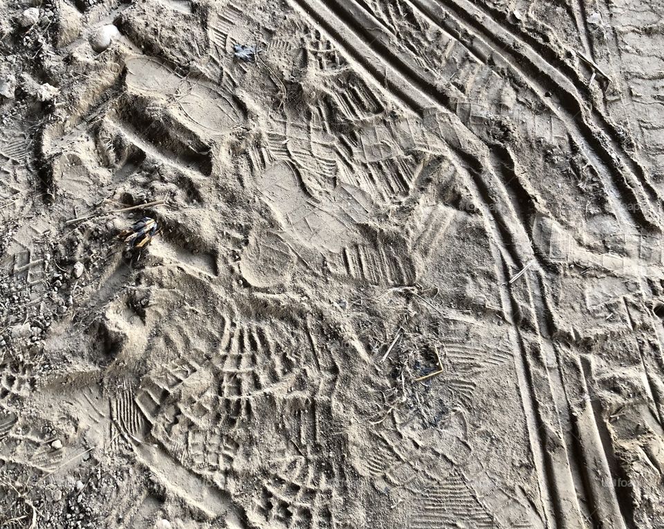Shoe And Tire Print Art In The Sand