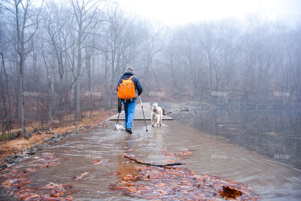 A man goes hiking with his best friend 