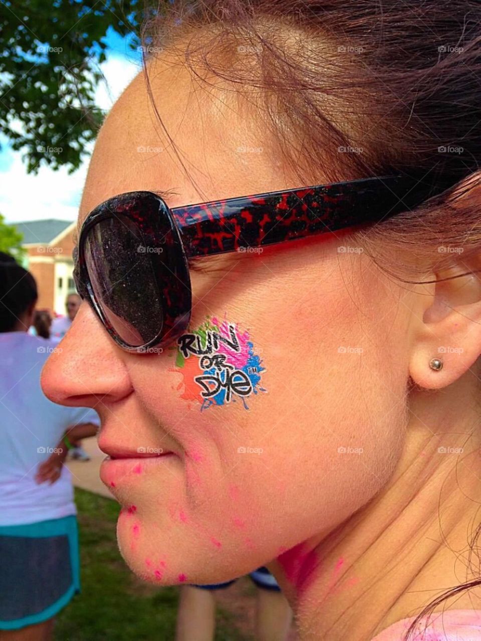 Run or Dye cheek tattoo. 