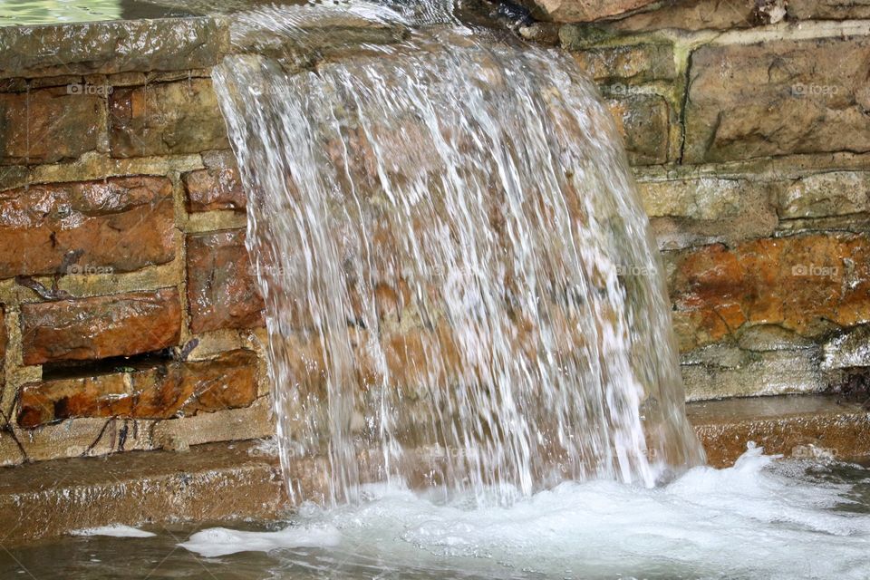 Waterfall over slab rock wall