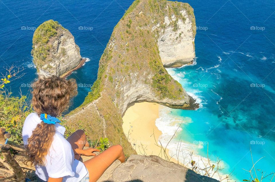Sitting on the edge of the island over looking where the land meets the sea