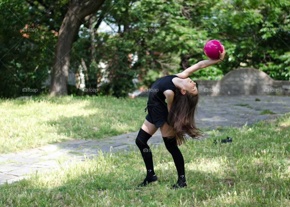 Beautiful Young Gimnast Dancing in Nature