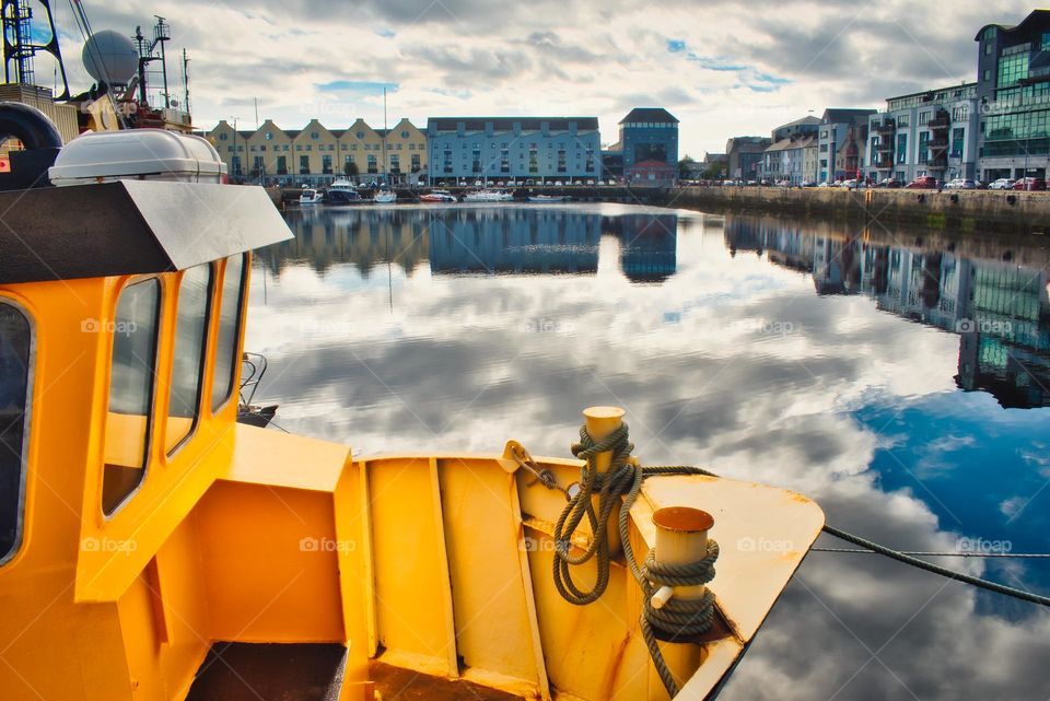 Yellow metal boat at Galway docks