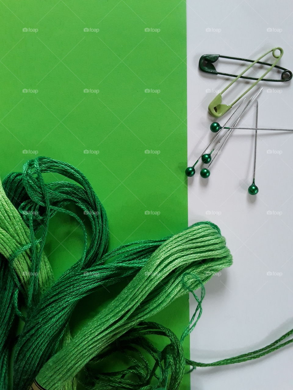 Green colour story:thread and pins