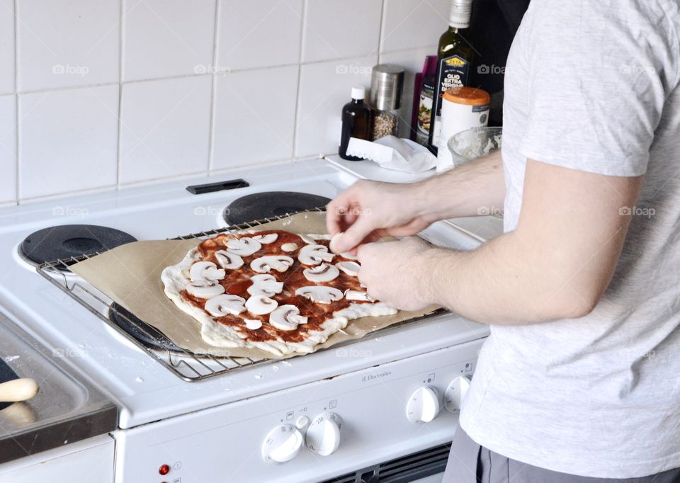A man making a pizza
