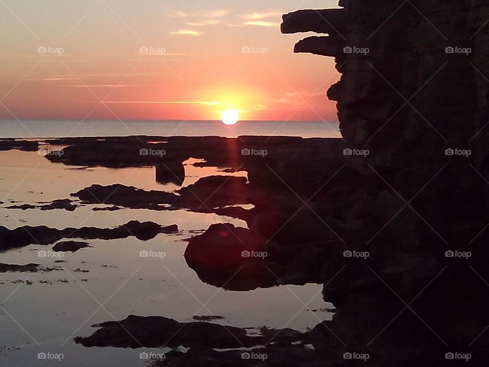 sea rock sunset