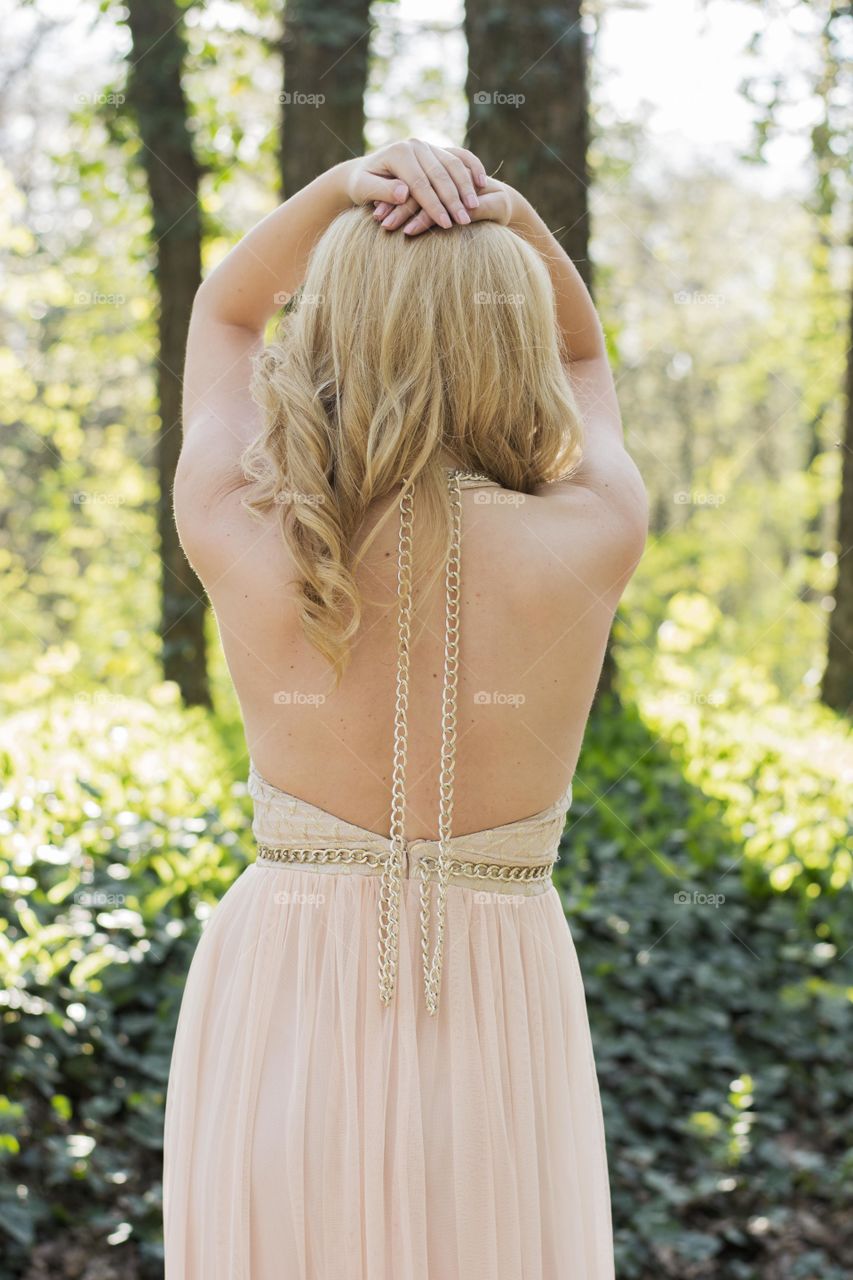 beautiful woman from back. woman in beautiful dress in outdoors from back