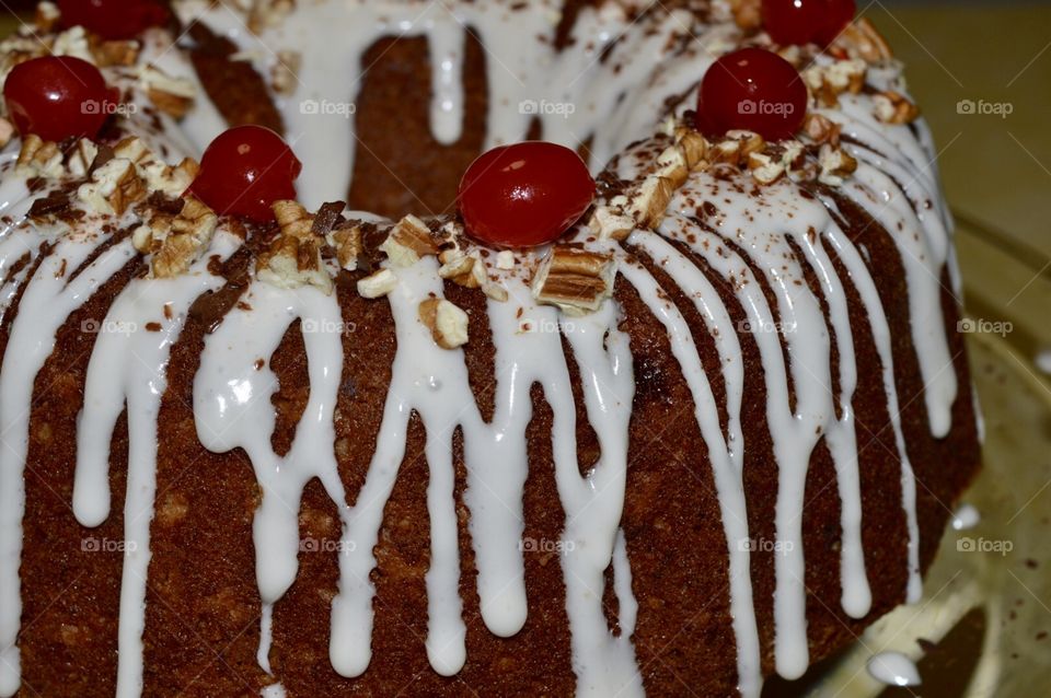 Bundt cake with glaze nuts and cherries 