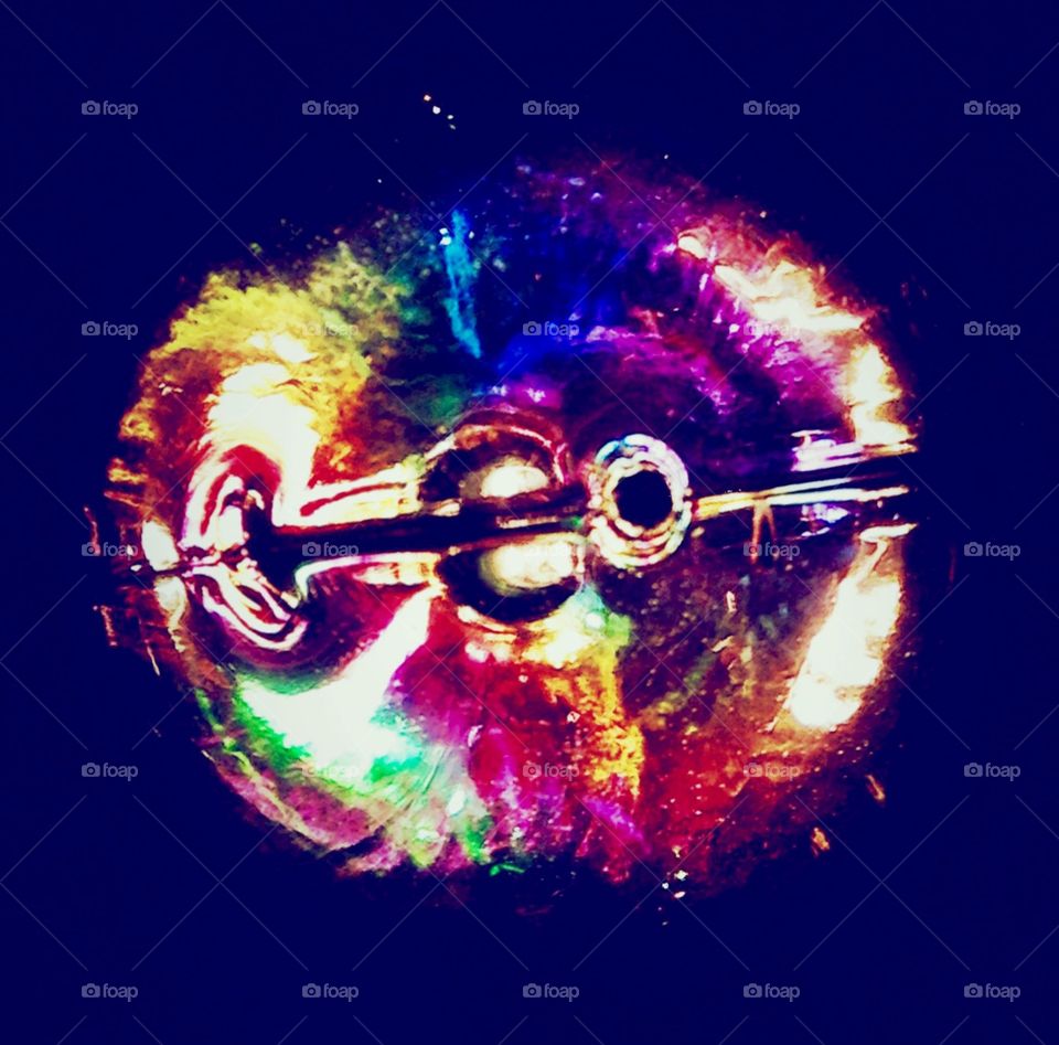 Colorful light . Closeup of a light bulb 