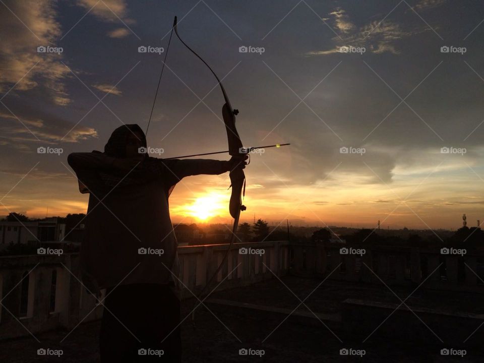 Archery Silhouette in the middle of Sunset