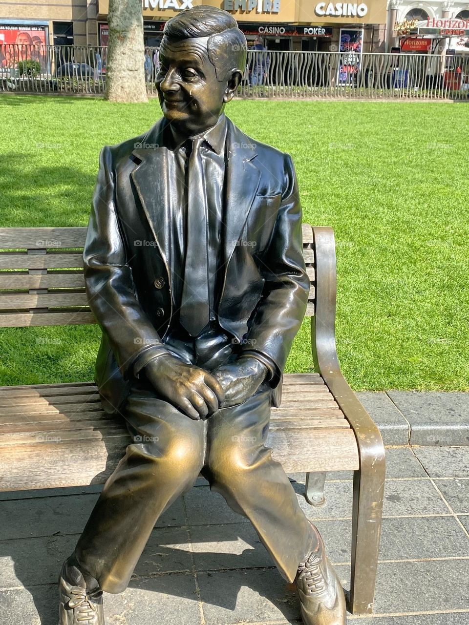 A Mr bean statue on a London bench