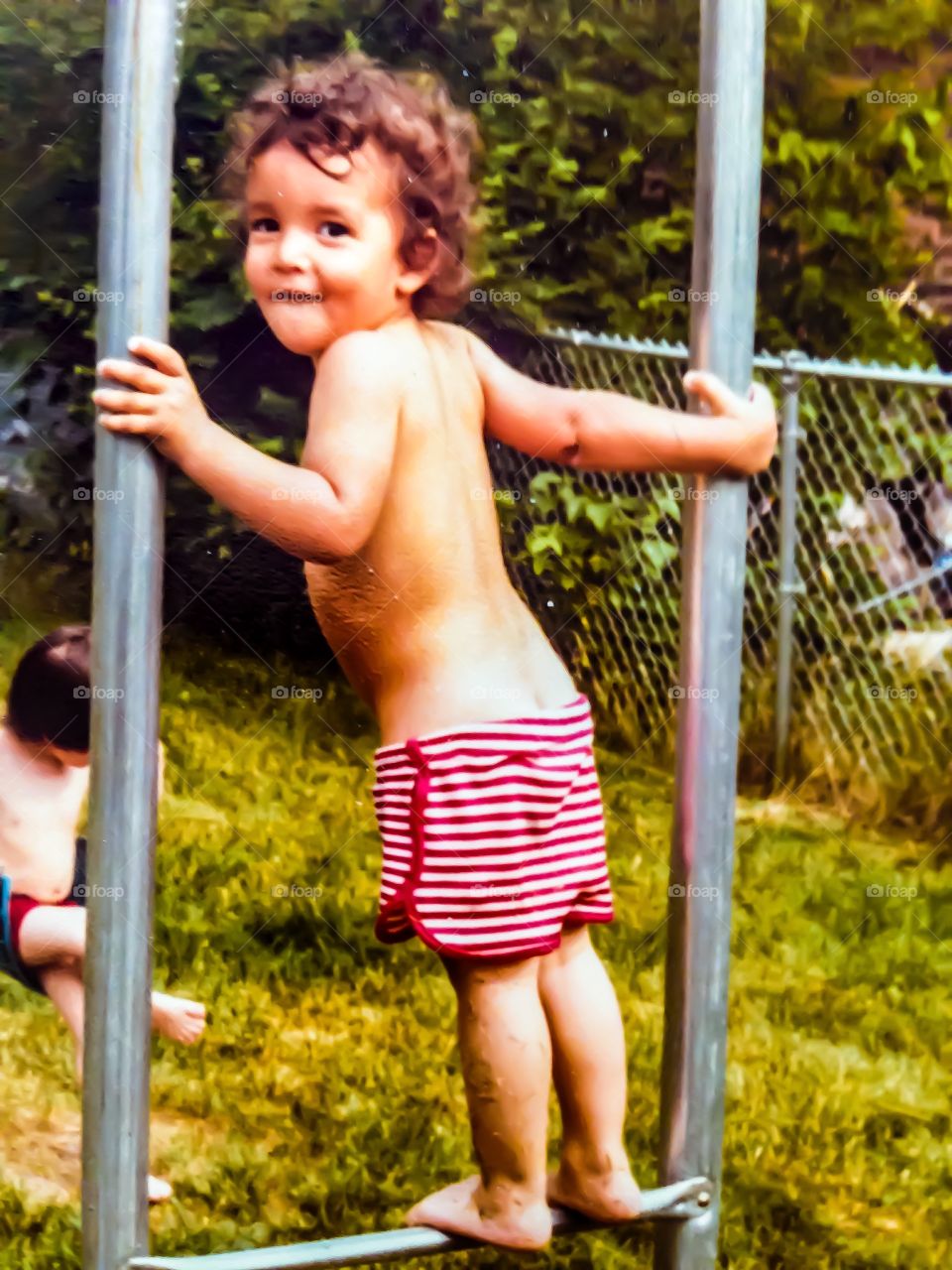 Toddler on monkey bars