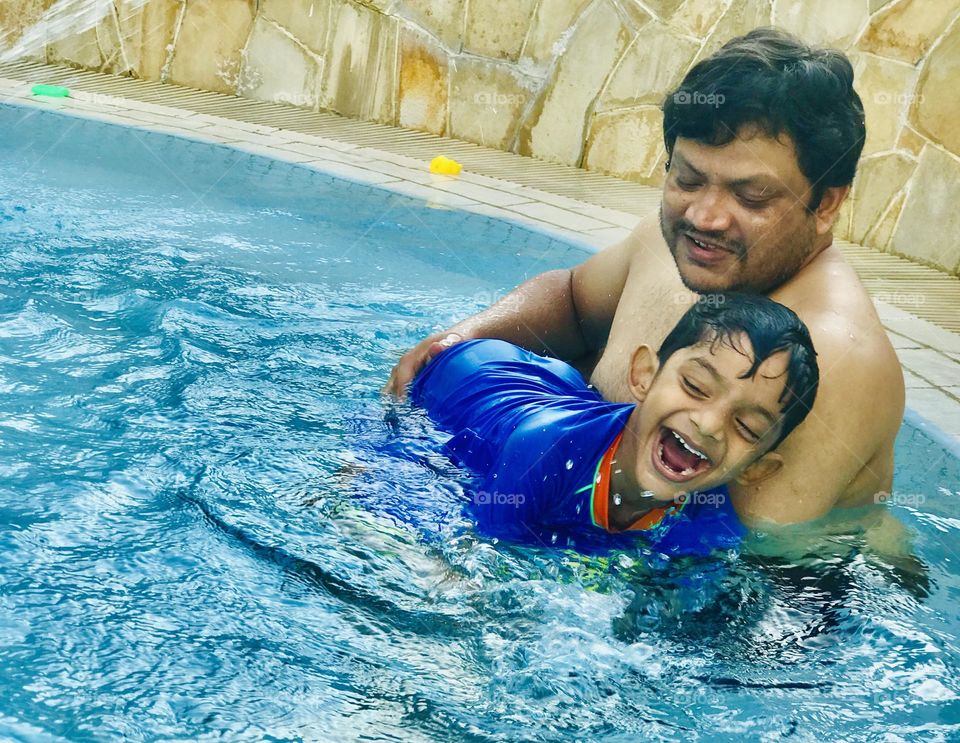 Father and son both enjoying and playing at swimming pool 🏊‍♀️