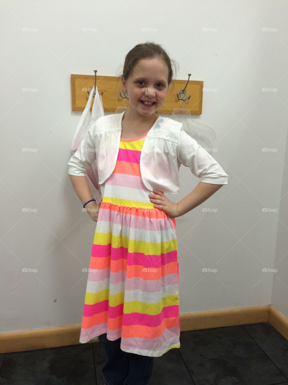 My little miss sassy step daughter trying on her dress in the dressing room. She loved the dress and was beautiful in it. Fun memories made shopping with this sassy girl!