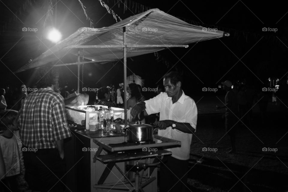 Popcorn seller working at night