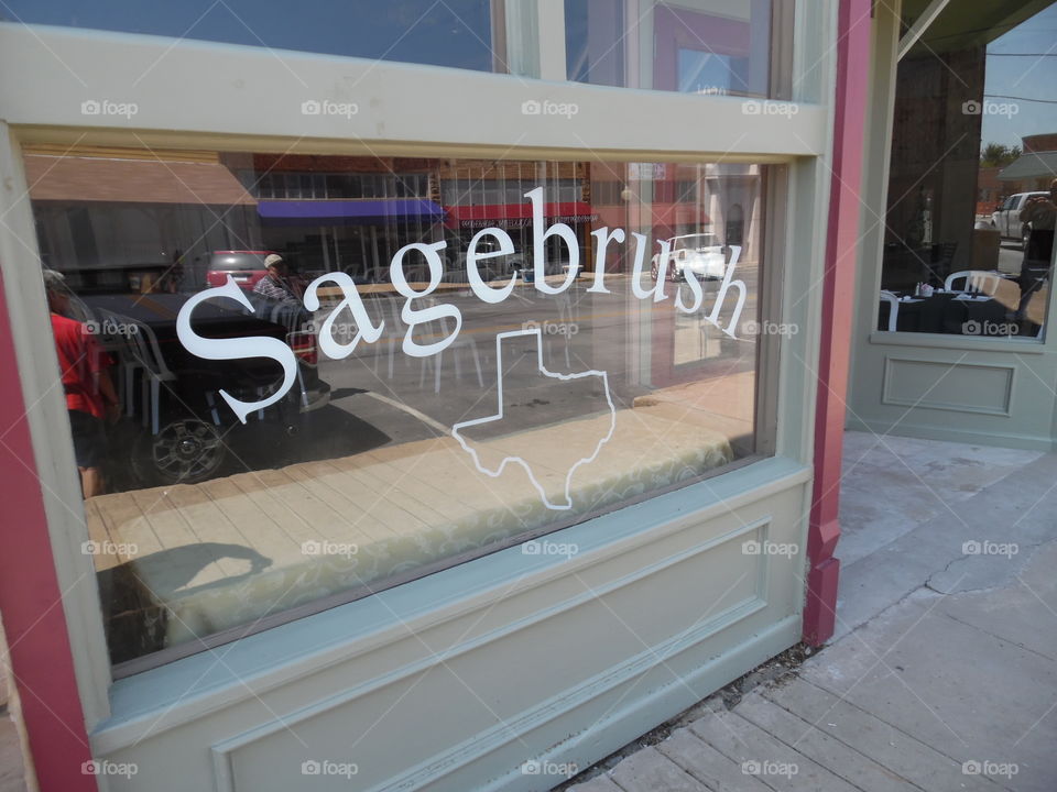 sagebrush Texas sign. This is a picture of a window front in Bridgeport Texas