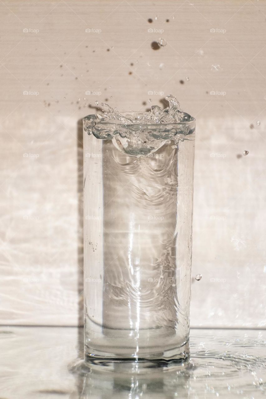 water ripples in glass on white background